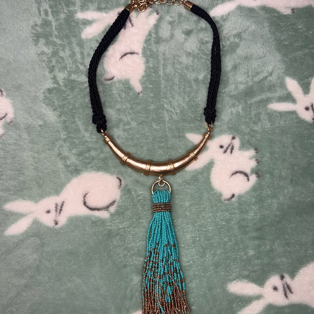 Black/gold bib necklace with tassel